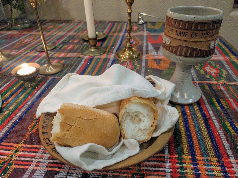 broken bread and stoneware chalice